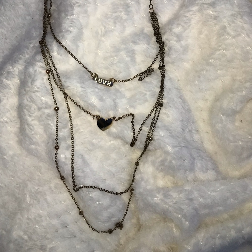 This is a love necklace stacked necklace
